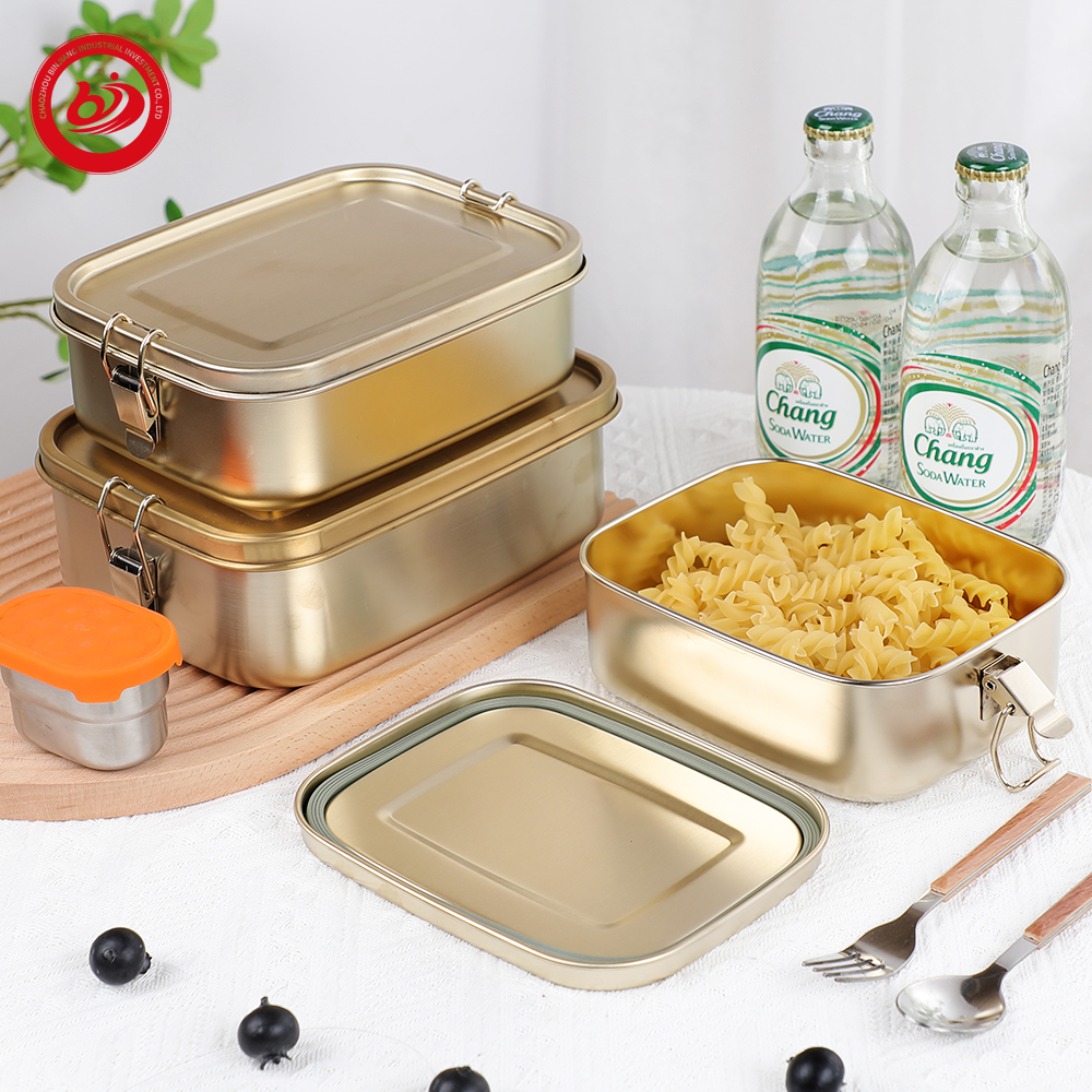 Contenitori rettangolari in acciaio inossidabile con rivestimento dorato. Scatola per il pranzo a tenuta stagna 